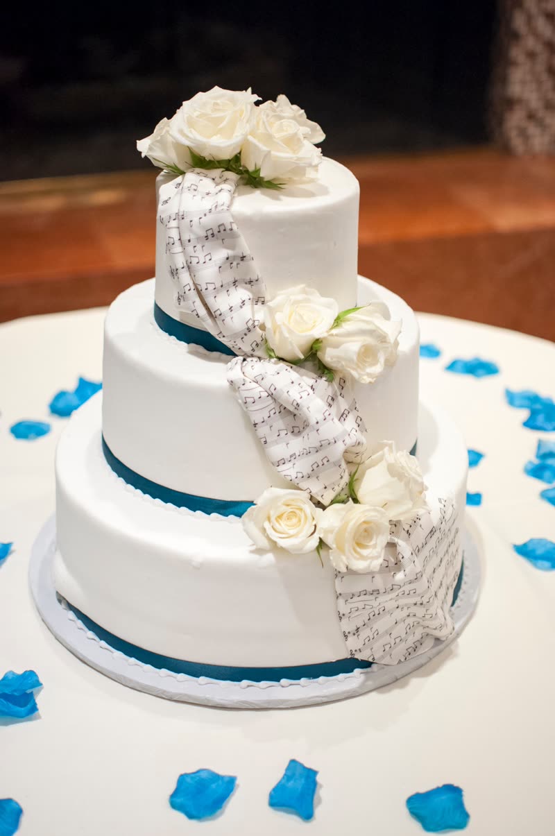 Three tier cake with white roses